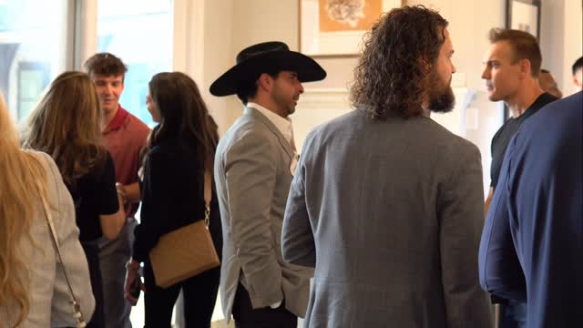 Guests gathered in conversation at the AmplifyU event
