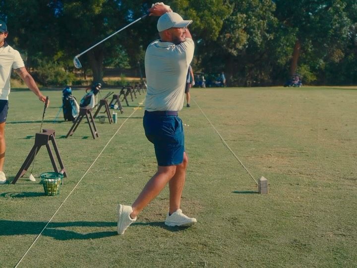 Golfer taking a shot on a sunny course in Fort Worth